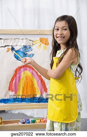 Side profile of a schoolgirl painting in an art class and smiling View Large Photo Image Stock Image - Side profile of a schoolgirl painting in an art class and smiling. Fotosearch