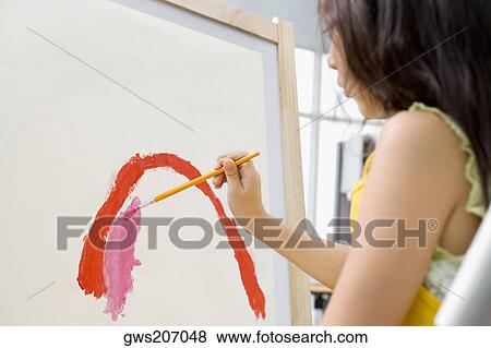 Side profile of a schoolgirl painting in an art class View Large Photo Image Stock Photo - Side profile of a schoolgirl painting in an art class. Fotosearch