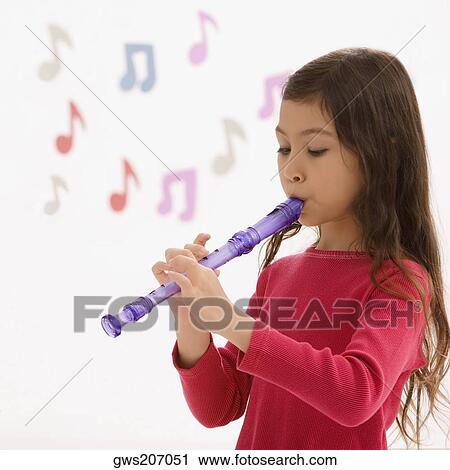 Side profile of a schoolgirl playing a flute in a classroom View Large Photo Image Stock Image - Side profile of a schoolgirl playing a flute in a classroom. Fotosearch