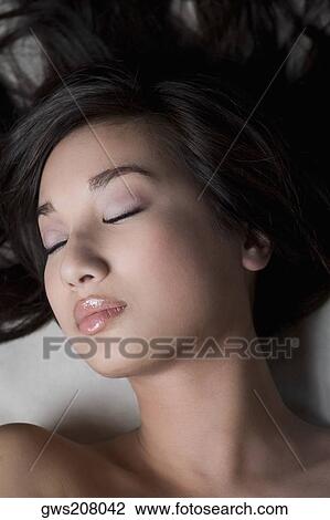 Close-up of a young woman sleeping on a massage table View Large Photo Image Stock Image - Close-up of a young woman sleeping on a massage table. Fotosearch