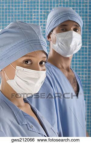 Stock Photograph - Close-up of a female surgeon and a male surgeon. Fotosearch