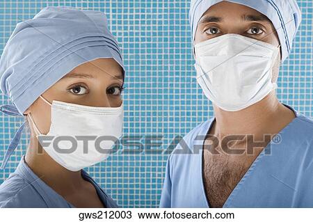 Close-up of a male surgeon and a female surgeon View Large Photo Image Stock Image - Close-up of a male surgeon and a female surgeon. Fotosearch