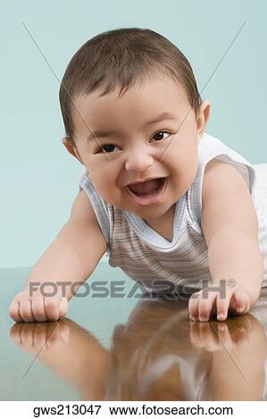Stock Photo - Close-up of a baby boy smiling. Fotosearch