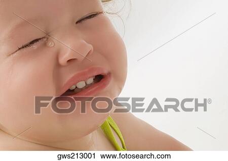 Stock Image - Close-up of a girl crying. Fotosearch