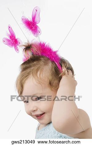 Stock Photo - Close-up of a girl smiling. Fotosearch