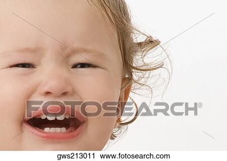 Stock Image - Portrait of a girl crying. Fotosearch