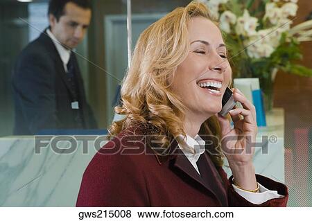 Close-up of a mature woman talking on a mobile phone View Large Photo Image Stock Photo - Close-up of a mature woman talking on a mobile phone. Fotosearch