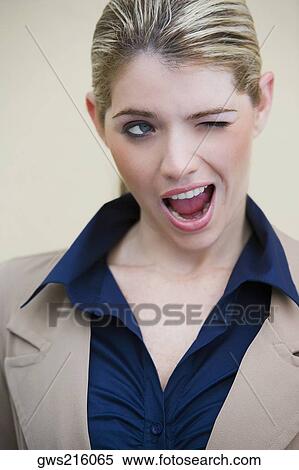 Close-up of a businesswoman winking View Large Photo Image Stock Photography - Close-up of a businesswoman winking. Fotosearch