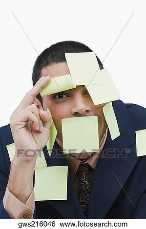 Portrait of a businessman covered with adhesive notes View Large Photo Image Stock Photograph - Portrait of a businessman covered with adhesive notes. Fotosearch
