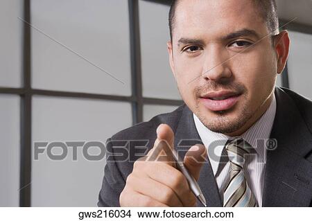Portrait of a businessman gesturing View Large Photo Image Picture - Portrait of a businessman gesturing. Fotosearch