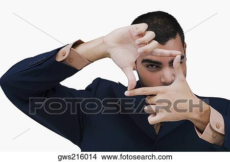 Picture - Portrait of a businessman making a finger frame. Fotosearch