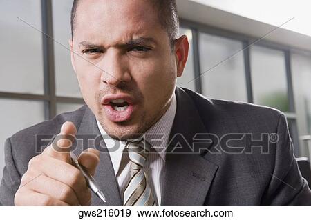 Stock Photo - Portrait of a businessman shouting. Fotosearch