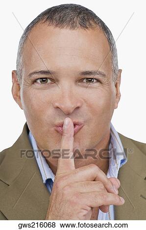 Portrait of a mature man with his finger on his lips View Large Photo Image Stock Photo - Portrait of a mature man with his finger on his lips. Fotosearch