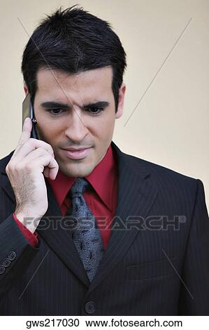 Close-up of a businessman talking on a mobile phone View Large Photo Image Stock Image - Close-up of a businessman talking on a mobile phone. Fotosearch