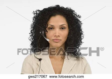 Portrait of a female customer service representative wearing a headset View Large Photo Image Stock Photo - Portrait of a female customer service representative wearing a headset. Fotosearch