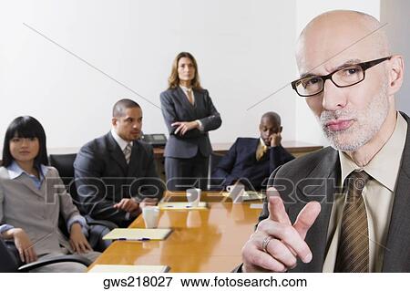 Business executives in a board room View Large Photo Image Stock Photo - Business executives in a board room. Fotosearch