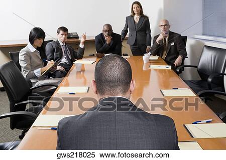 Group of business executives discussing in a meeting View Large Photo Image Stock Photography - Group of business executives discussing in a meeting. Fotosearch