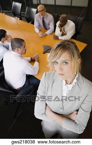 Portrait of a businesswoman standing in a board room View Large Photo Image Stock Photo - Portrait of a businesswoman standing in a board room. Fotosearch
