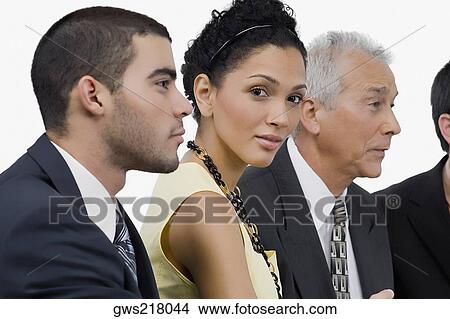 Three businessmen and a businesswoman at a meeting in a conference room View Large Photo Image Picture - Three businessmen and a businesswoman at a meeting in a conference room. Fotosearch