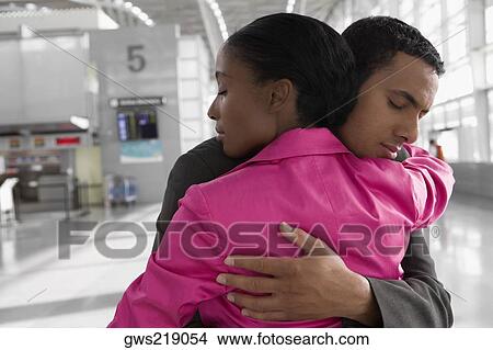 Close-up of a businessman and a businesswoman hugging each other and crying View Large Photo Image Picture - Close-up of a businessman and a businesswoman hugging each other and crying. Fotosearch