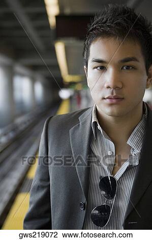 Portrait of a businessman at a subway station View Large Photo Image Stock Image - Portrait of a businessman at a subway station. Fotosearch