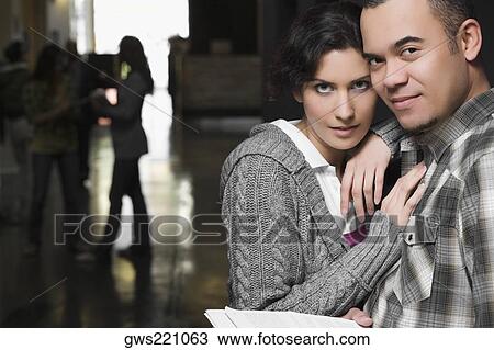 Stock Image - Portrait of a young couple in a corridor. Fotosearch