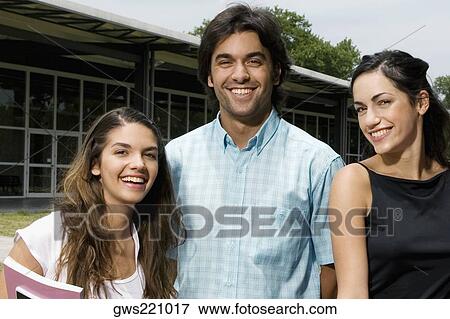 Stock Photo - Portrait of three university students smiling. Fotosearch