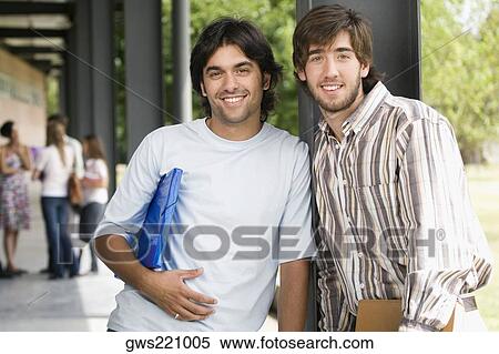 Portrait of two male university students standing in a corridor and smiling View Large Photo Image Stock Photography - Portrait of two male university students standing in a corridor and smiling. Fotosearch