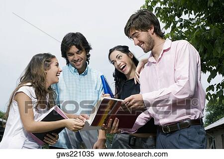 Stock Photography - University students discussing and smiling. Fotosearch