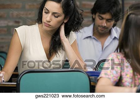 University students in a classroom View Large Photo Image Stock Image - University students in a classroom. Fotosearch
