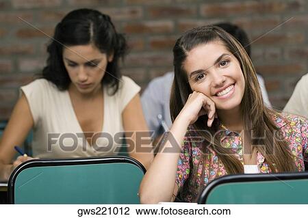University students sitting in a classroom View Large Photo Image Stock Image - University students sitting in a classroom. Fotosearch