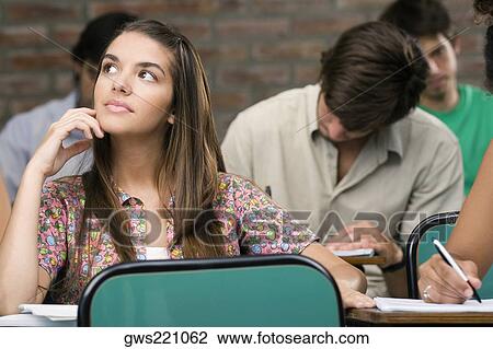 University students sitting in a classroom View Large Photo Image Stock Image - University students sitting in a classroom. Fotosearch