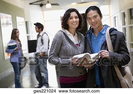 University students standing in a corridor View Large Photo Image Picture - University students standing in a corridor. Fotosearch
