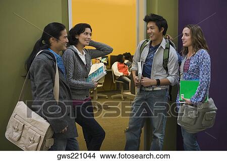 University students standing together in a corridor View Large Photo Image Picture - University students standing together in a corridor. Fotosearch