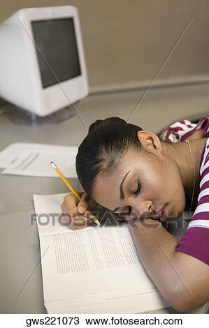 Young man napping on a book View Large Photo Image Stock Image - Young man napping on a book. Fotosearch
