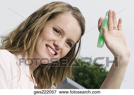 Close-up of a young woman smiling View Large Photo Image Stock Photo - Close-up of a young woman smiling. Fotosearch