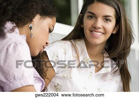 Portrait of two university students smiling View Large Photo Image Picture - Portrait of two university students smiling. Fotosearch
