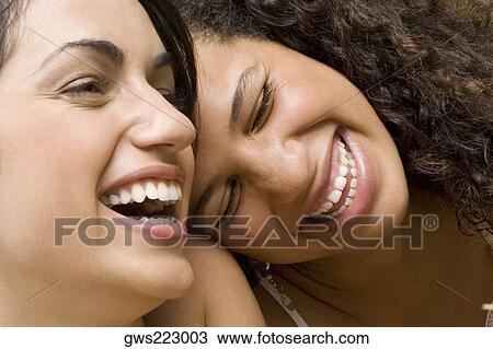 Close-up of two university students laughing View Large Photo Image Stock Image - Close-up of two university students laughing. Fotosearch