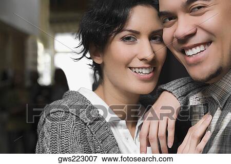 Portrait of a young couple smiling View Large Photo Image Stock Photo - Portrait of a young couple smiling. Fotosearch
