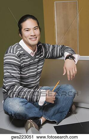 Stock Image - Portrait of a young man smiling. Fotosearch