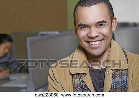 Stock Photo - Portrait of a young man smiling. Fotosearch