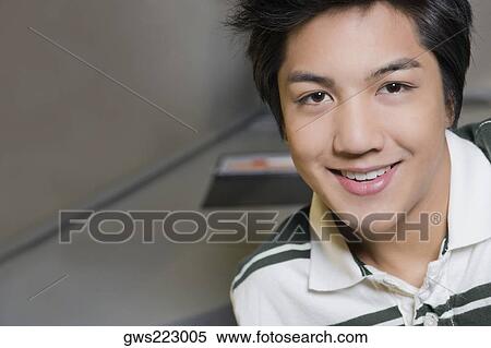 Portrait of a young man smiling View Large Photo Image Stock Photography - Portrait of a young man smiling. Fotosearch