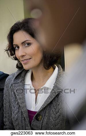 Portrait of a young woman smiling View Large Photo Image Stock Image - Portrait of a young woman smiling. Fotosearch