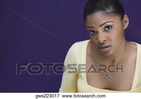 Portrait of a young woman View Large Photo Image Stock Photo - Portrait of a young woman. Fotosearch