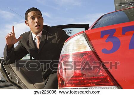 Businessman hailing another taxi View Large Photo Image Stock Photograph - Businessman hailing another taxi. Fotosearch