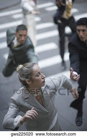 High angle view of business executives chasing a businesswoman View Large Photo Image Stock Image - High angle view of business executives chasing a businesswoman. Fotosearch