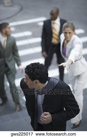 High angle view of business executives chasing a businessman View Large Photo Image Stock Photo - High angle view of business executives chasing a businessman. Fotosearch