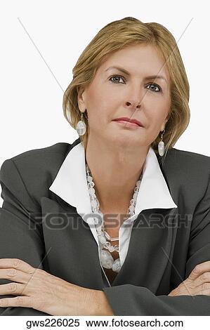 Close-up of a businesswoman thinking with her arms crossed View Large Photo Image Stock Photography - Close-up of a businesswoman thinking with her arms crossed. Fotosearch