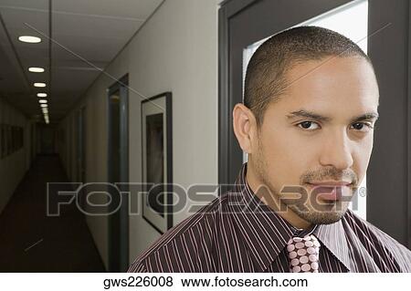Portrait of a businessman smiling View Large Photo Image Stock Photo - Portrait of a businessman smiling. Fotosearch