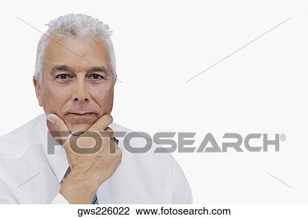 Portrait of a businessman thinking with his hand on his chin View Large Photo Image Stock Image - Portrait of a businessman thinking with his hand on his chin. Fotosearch
